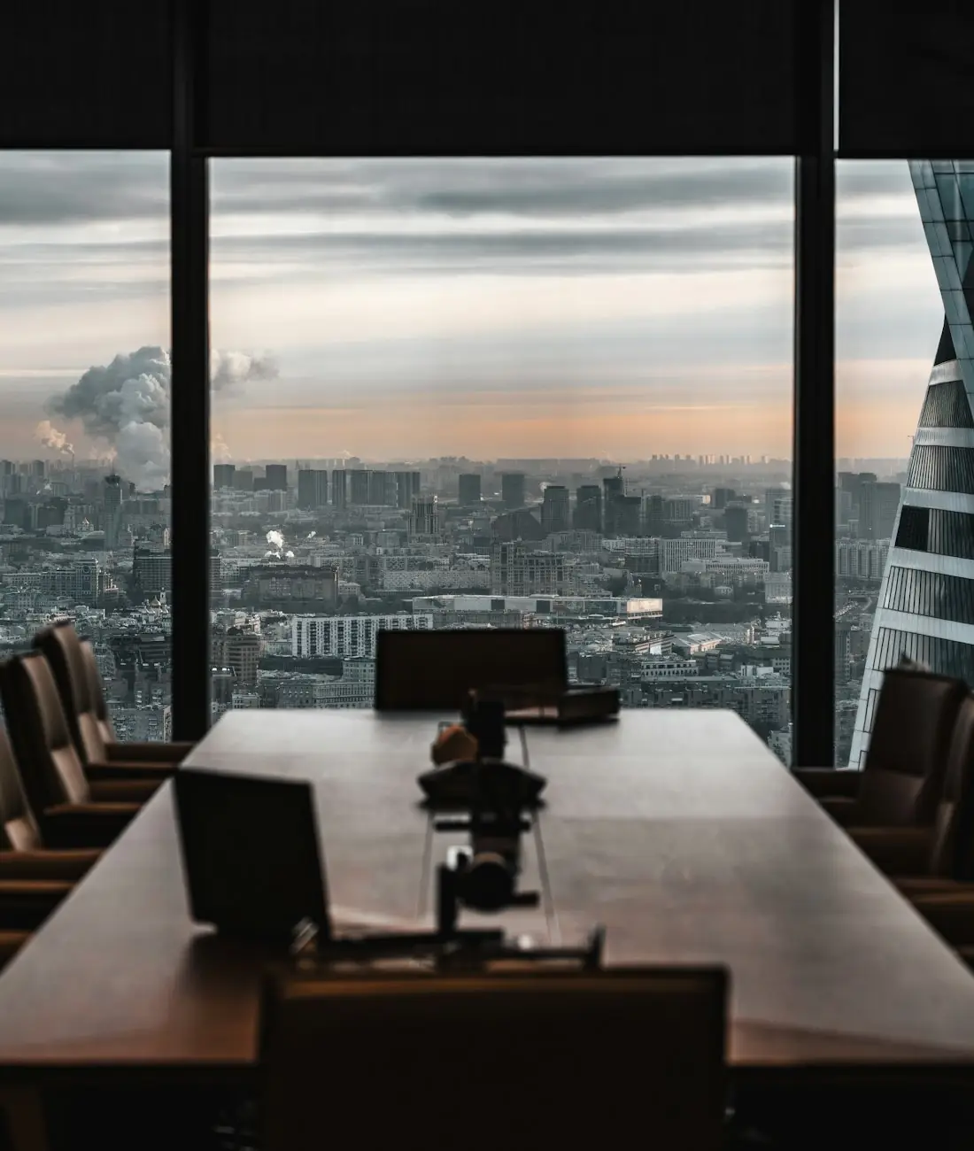 Boardroom with floor-to-ceiling windows overlooking the city